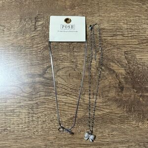 2 New silver bow necklaces.